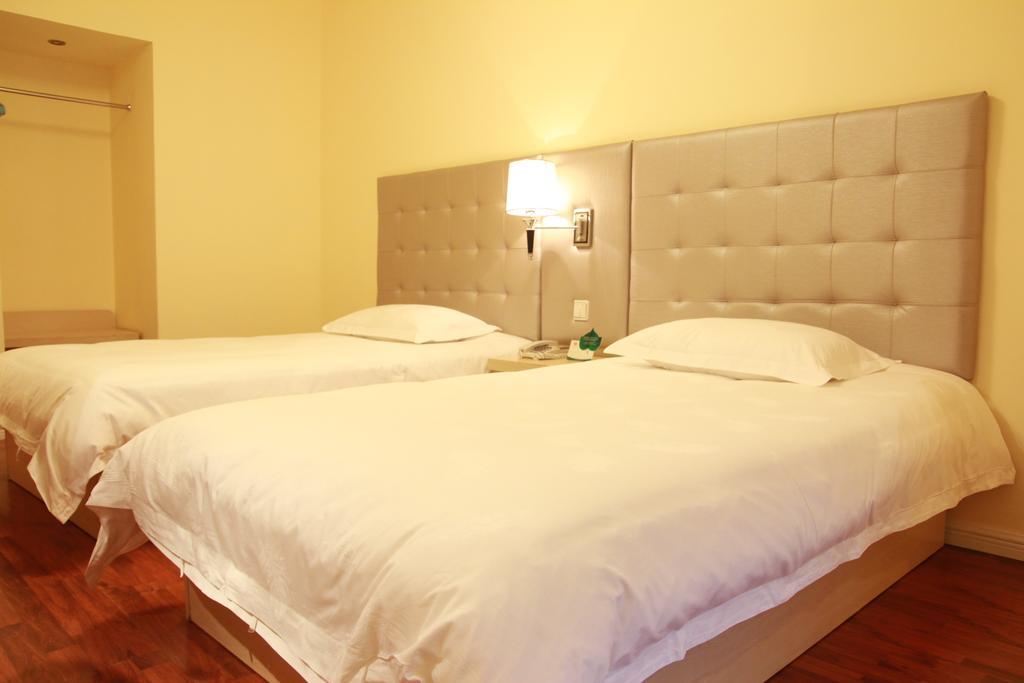 Qingdao Renjia Bussiness Hotel Стая снимка