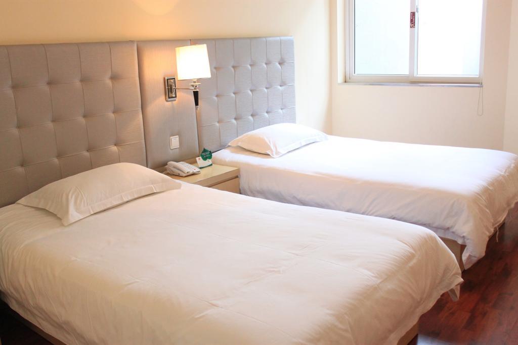 Qingdao Renjia Bussiness Hotel Стая снимка