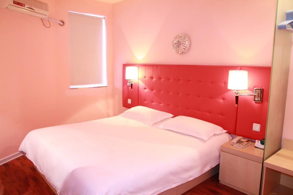 Qingdao Renjia Bussiness Hotel Стая снимка